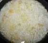 В завершении рис, который предварительно нужно несколько раз промыть в холодной воде. 
Залить кипятком на 1 см выше риса, накрыть крышкой и на медленном огне довести до готовности(ориентироваться на рис).